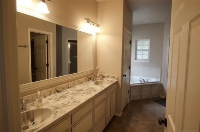 Located in the gated Magnolia Gardens community at Battle Creek on Battle Creek Golf Course in Oklahoma - for sale on GolfHomes.com, golf home, golf lot