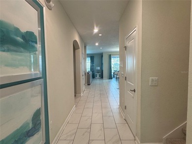 Located in the highly desirable ChampionsGate/The Retreat area on The Oasis Club at Champions Gate in Florida - for sale on GolfHomes.com, golf home, golf lot