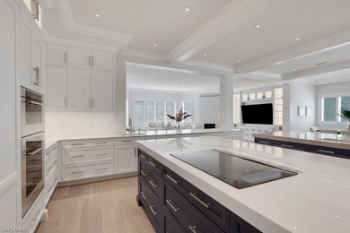 Experience elevated coastal living in this stunning Pelican Bay on Club at Pelican Bay Golf Course in Florida - for sale on GolfHomes.com, golf home, golf lot