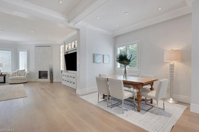 Experience elevated coastal living in this stunning Pelican Bay on Club at Pelican Bay Golf Course in Florida - for sale on GolfHomes.com, golf home, golf lot