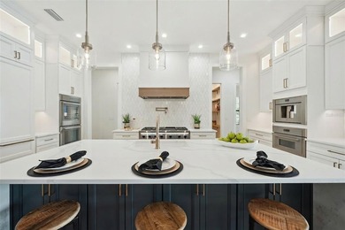 Step into this stunning West-Indies inspired luxury home crafted on Interlachen Country Club in Florida - for sale on GolfHomes.com, golf home, golf lot