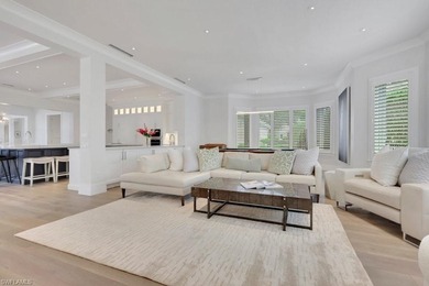 Experience elevated coastal living in this stunning Pelican Bay on Club at Pelican Bay Golf Course in Florida - for sale on GolfHomes.com, golf home, golf lot