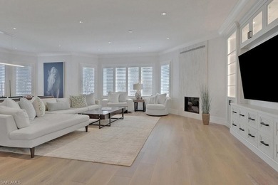 Experience elevated coastal living in this stunning Pelican Bay on Club at Pelican Bay Golf Course in Florida - for sale on GolfHomes.com, golf home, golf lot