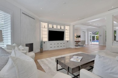 Experience elevated coastal living in this stunning Pelican Bay on Club at Pelican Bay Golf Course in Florida - for sale on GolfHomes.com, golf home, golf lot