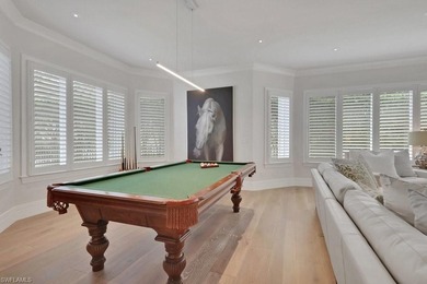 Experience elevated coastal living in this stunning Pelican Bay on Club at Pelican Bay Golf Course in Florida - for sale on GolfHomes.com, golf home, golf lot