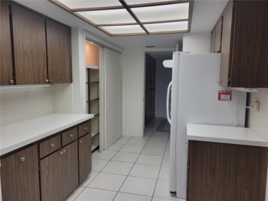 Priced to make it your own! Quiet & rare 3 bedroom, 2 bathroom on Countryside Country Club in Florida - for sale on GolfHomes.com, golf home, golf lot