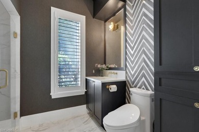 Experience elevated coastal living in this stunning Pelican Bay on Club at Pelican Bay Golf Course in Florida - for sale on GolfHomes.com, golf home, golf lot