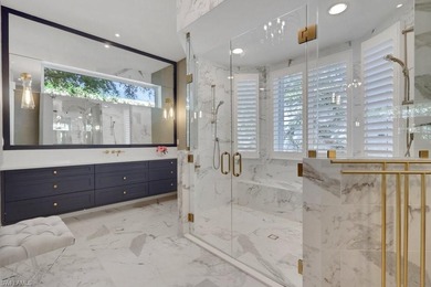 Experience elevated coastal living in this stunning Pelican Bay on Club at Pelican Bay Golf Course in Florida - for sale on GolfHomes.com, golf home, golf lot