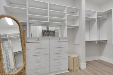 Experience elevated coastal living in this stunning Pelican Bay on Club at Pelican Bay Golf Course in Florida - for sale on GolfHomes.com, golf home, golf lot