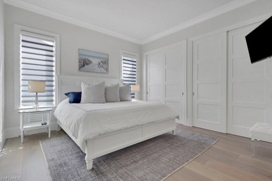 Experience elevated coastal living in this stunning Pelican Bay on Club at Pelican Bay Golf Course in Florida - for sale on GolfHomes.com, golf home, golf lot