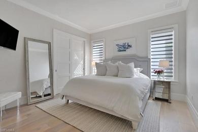 Experience elevated coastal living in this stunning Pelican Bay on Club at Pelican Bay Golf Course in Florida - for sale on GolfHomes.com, golf home, golf lot