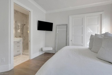 Experience elevated coastal living in this stunning Pelican Bay on Club at Pelican Bay Golf Course in Florida - for sale on GolfHomes.com, golf home, golf lot