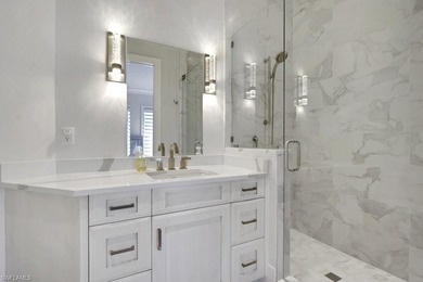 Experience elevated coastal living in this stunning Pelican Bay on Club at Pelican Bay Golf Course in Florida - for sale on GolfHomes.com, golf home, golf lot