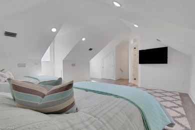 Experience elevated coastal living in this stunning Pelican Bay on Club at Pelican Bay Golf Course in Florida - for sale on GolfHomes.com, golf home, golf lot