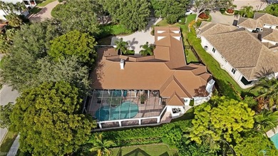 Experience elevated coastal living in this stunning Pelican Bay on Club at Pelican Bay Golf Course in Florida - for sale on GolfHomes.com, golf home, golf lot