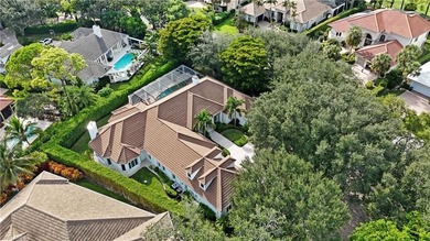 Experience elevated coastal living in this stunning Pelican Bay on Club at Pelican Bay Golf Course in Florida - for sale on GolfHomes.com, golf home, golf lot