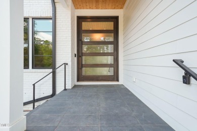 Experience elevated living in this custom luxury home located in on North Ridge Country Club in North Carolina - for sale on GolfHomes.com, golf home, golf lot