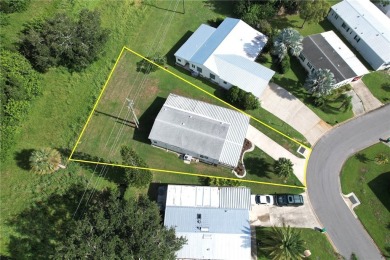 Spacious perimeter lot! This well-maintained home offers an on Barefoot Bay Golf Course in Florida - for sale on GolfHomes.com, golf home, golf lot