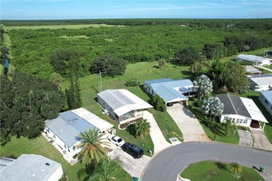 Spacious perimeter lot! This well-maintained home offers an on Barefoot Bay Golf Course in Florida - for sale on GolfHomes.com, golf home, golf lot