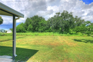 Spacious perimeter lot! This well-maintained home offers an on Barefoot Bay Golf Course in Florida - for sale on GolfHomes.com, golf home, golf lot