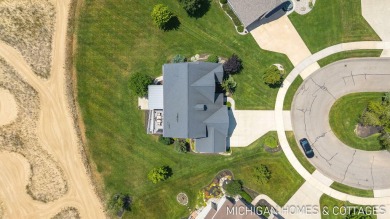 Welcome to 4401 Grand Point, a stunning home nestled on nearly on The Macatwa Legends Golf Course in Michigan - for sale on GolfHomes.com, golf home, golf lot