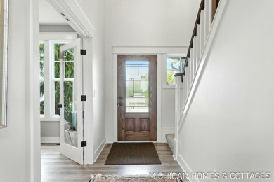 Welcome to 4401 Grand Point, a stunning home nestled on nearly on The Macatwa Legends Golf Course in Michigan - for sale on GolfHomes.com, golf home, golf lot