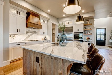 Harmony Club Stunner offering a perfect balance of refined on Harmony Golf Club in Colorado - for sale on GolfHomes.com, golf home, golf lot