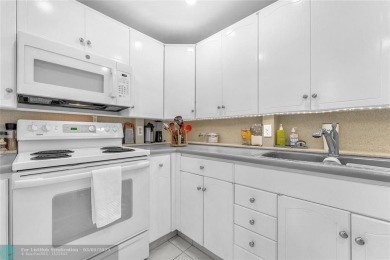 Enjoy South Florida living with this 2Bed/2Bath second floor on Hillsboro Pines Golf in Florida - for sale on GolfHomes.com, golf home, golf lot