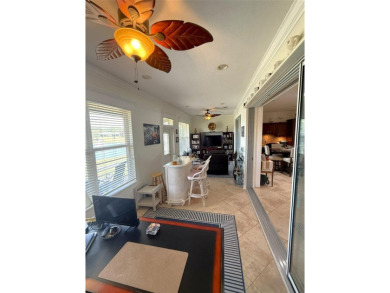 This stunning water-front single-family home at 13111 SE 86th on Eagle Ridge At Spruce Creek Country Club in Florida - for sale on GolfHomes.com, golf home, golf lot