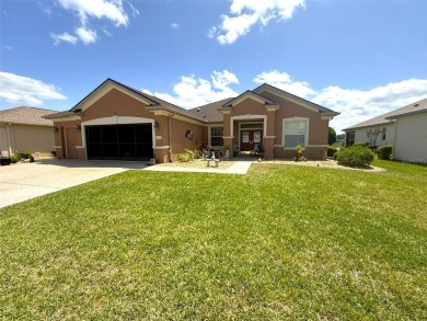 This stunning water-front single-family home at 13111 SE 86th on Eagle Ridge At Spruce Creek Country Club in Florida - for sale on GolfHomes.com, golf home, golf lot