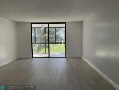 Stylish and serene 2-bedroom, 2-bathroom condo with breathtaking on Oriole Golf and Tennis Club in Florida - for sale on GolfHomes.com, golf home, golf lot
