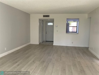 Stylish and serene 2-bedroom, 2-bathroom condo with breathtaking on Oriole Golf and Tennis Club in Florida - for sale on GolfHomes.com, golf home, golf lot