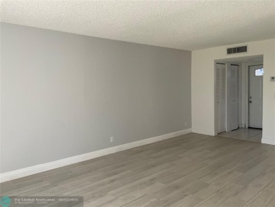 Stylish and serene 2-bedroom, 2-bathroom condo with breathtaking on Oriole Golf and Tennis Club in Florida - for sale on GolfHomes.com, golf home, golf lot