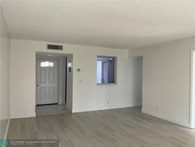 Stylish and serene 2-bedroom, 2-bathroom condo with breathtaking on Oriole Golf and Tennis Club in Florida - for sale on GolfHomes.com, golf home, golf lot