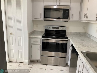 Stylish and serene 2-bedroom, 2-bathroom condo with breathtaking on Oriole Golf and Tennis Club in Florida - for sale on GolfHomes.com, golf home, golf lot