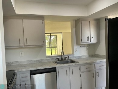Stylish and serene 2-bedroom, 2-bathroom condo with breathtaking on Oriole Golf and Tennis Club in Florida - for sale on GolfHomes.com, golf home, golf lot