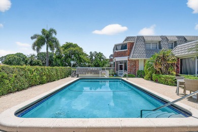This updated first-floor condo combines comfort, security, and on Atlantis Golf Club in Florida - for sale on GolfHomes.com, golf home, golf lot