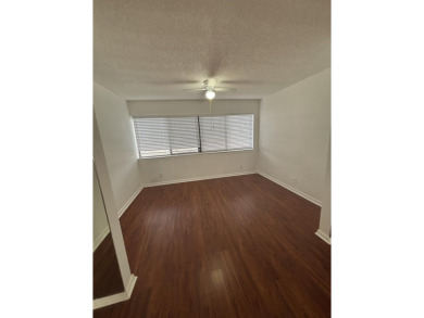 Beautiful first floor unit 2 beds/ 2 baths with a lake view in a on Forest Oaks Golf Club in Florida - for sale on GolfHomes.com, golf home, golf lot