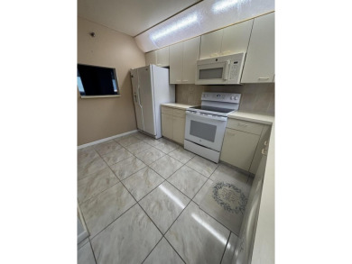 Beautiful first floor unit 2 beds/ 2 baths with a lake view in a on Forest Oaks Golf Club in Florida - for sale on GolfHomes.com, golf home, golf lot