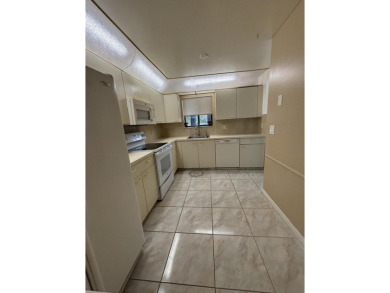 Beautiful first floor unit 2 beds/ 2 baths with a lake view in a on Forest Oaks Golf Club in Florida - for sale on GolfHomes.com, golf home, golf lot