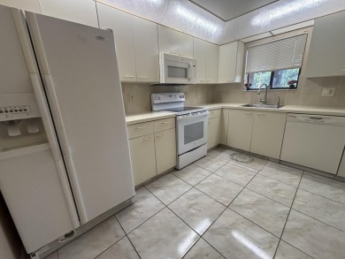 Beautiful first floor unit 2 beds/ 2 baths with a lake view in a on Forest Oaks Golf Club in Florida - for sale on GolfHomes.com, golf home, golf lot