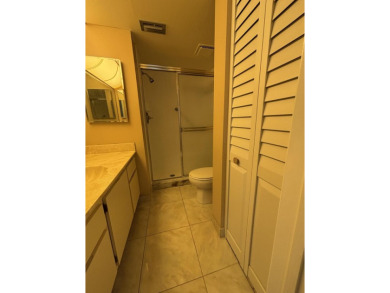 Beautiful first floor unit 2 beds/ 2 baths with a lake view in a on Forest Oaks Golf Club in Florida - for sale on GolfHomes.com, golf home, golf lot