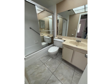 Beautiful first floor unit 2 beds/ 2 baths with a lake view in a on Forest Oaks Golf Club in Florida - for sale on GolfHomes.com, golf home, golf lot