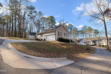 Situated on a prime corner lot in the highly sought-after gated on Carolina Trace Country Club in North Carolina - for sale on GolfHomes.com, golf home, golf lot