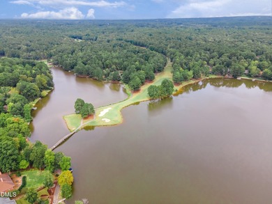 Situated on a prime corner lot in the highly sought-after gated on Carolina Trace Country Club in North Carolina - for sale on GolfHomes.com, golf home, golf lot