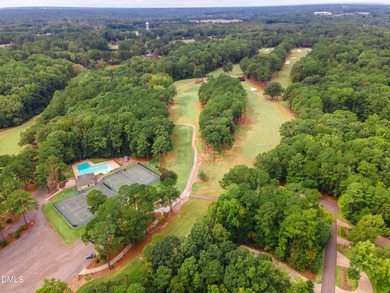 Situated on a prime corner lot in the highly sought-after gated on Carolina Trace Country Club in North Carolina - for sale on GolfHomes.com, golf home, golf lot