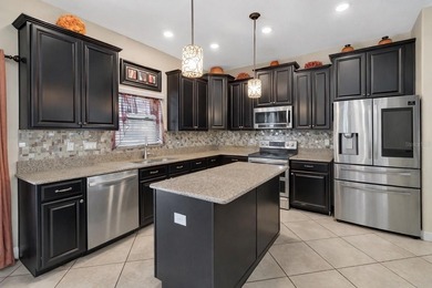 One or more photo(s) has been virtually staged. This home can be on The Oasis Club at Champions Gate in Florida - for sale on GolfHomes.com, golf home, golf lot