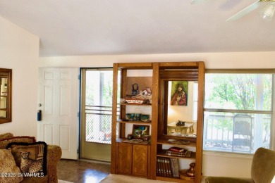 Nestled among the pines, this charming 2-bedroom, 2-bath home on Pine Shadows Golf Course in Arizona - for sale on GolfHomes.com, golf home, golf lot
