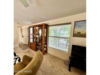 Nestled among the pines, this charming 2-bedroom, 2-bath home on Pine Shadows Golf Course in Arizona - for sale on GolfHomes.com, golf home, golf lot