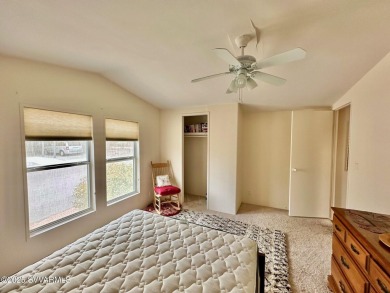 Nestled among the pines, this charming 2-bedroom, 2-bath home on Pine Shadows Golf Course in Arizona - for sale on GolfHomes.com, golf home, golf lot